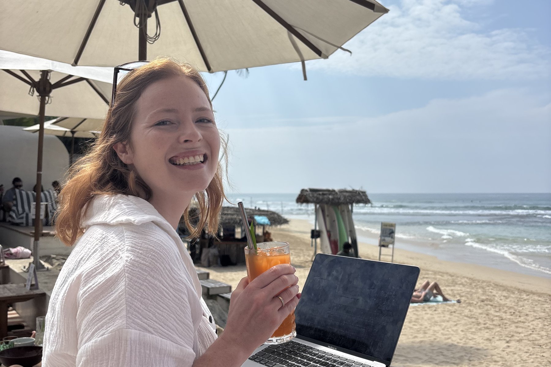 Ellen McDonald working remotely by the beach
